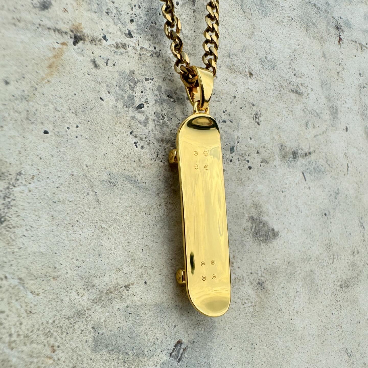 Colgante de patineta (oro)