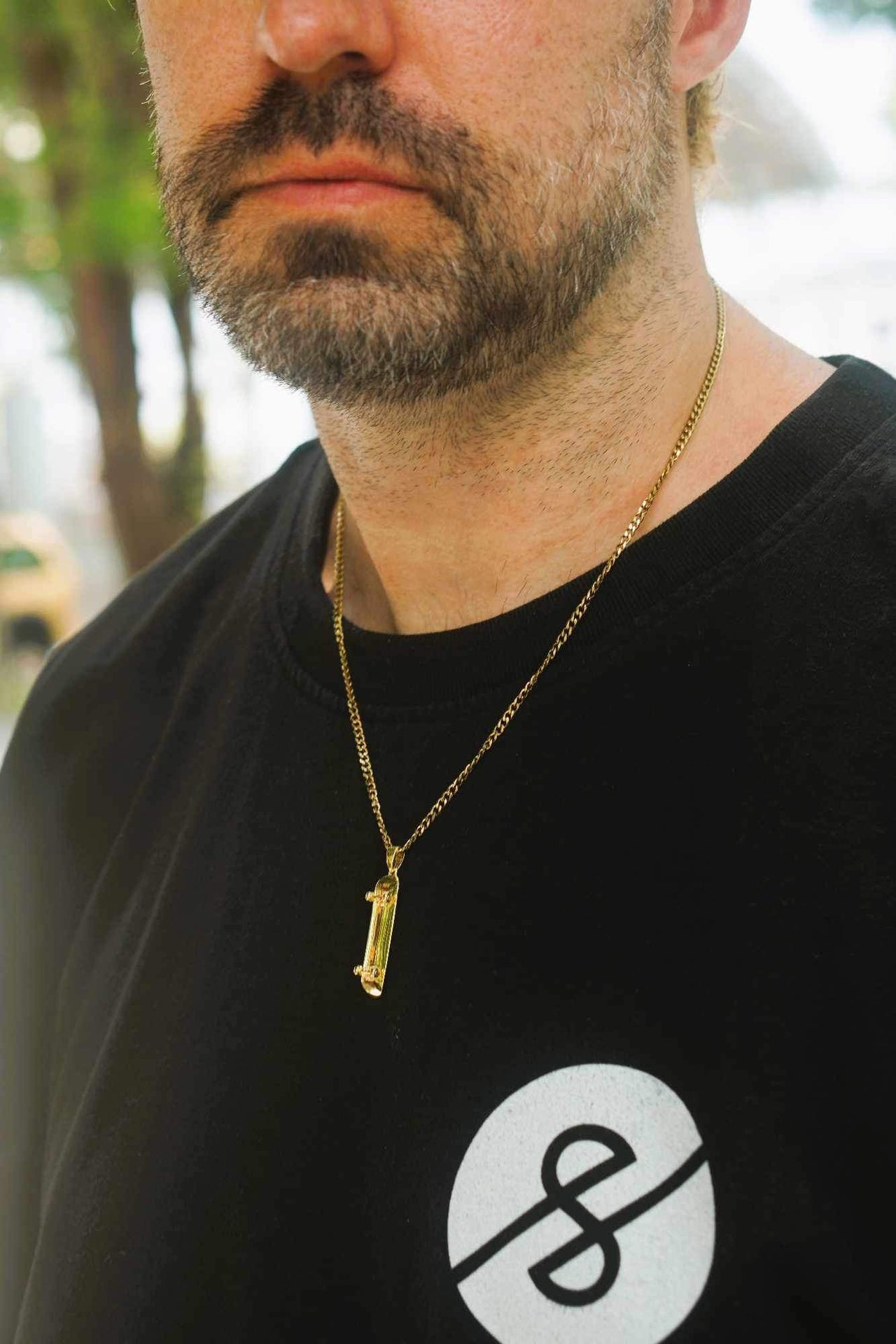 Colgante de patineta (oro)