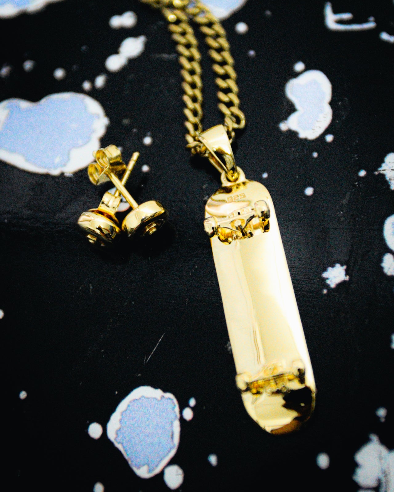 Colgante de patineta (oro)