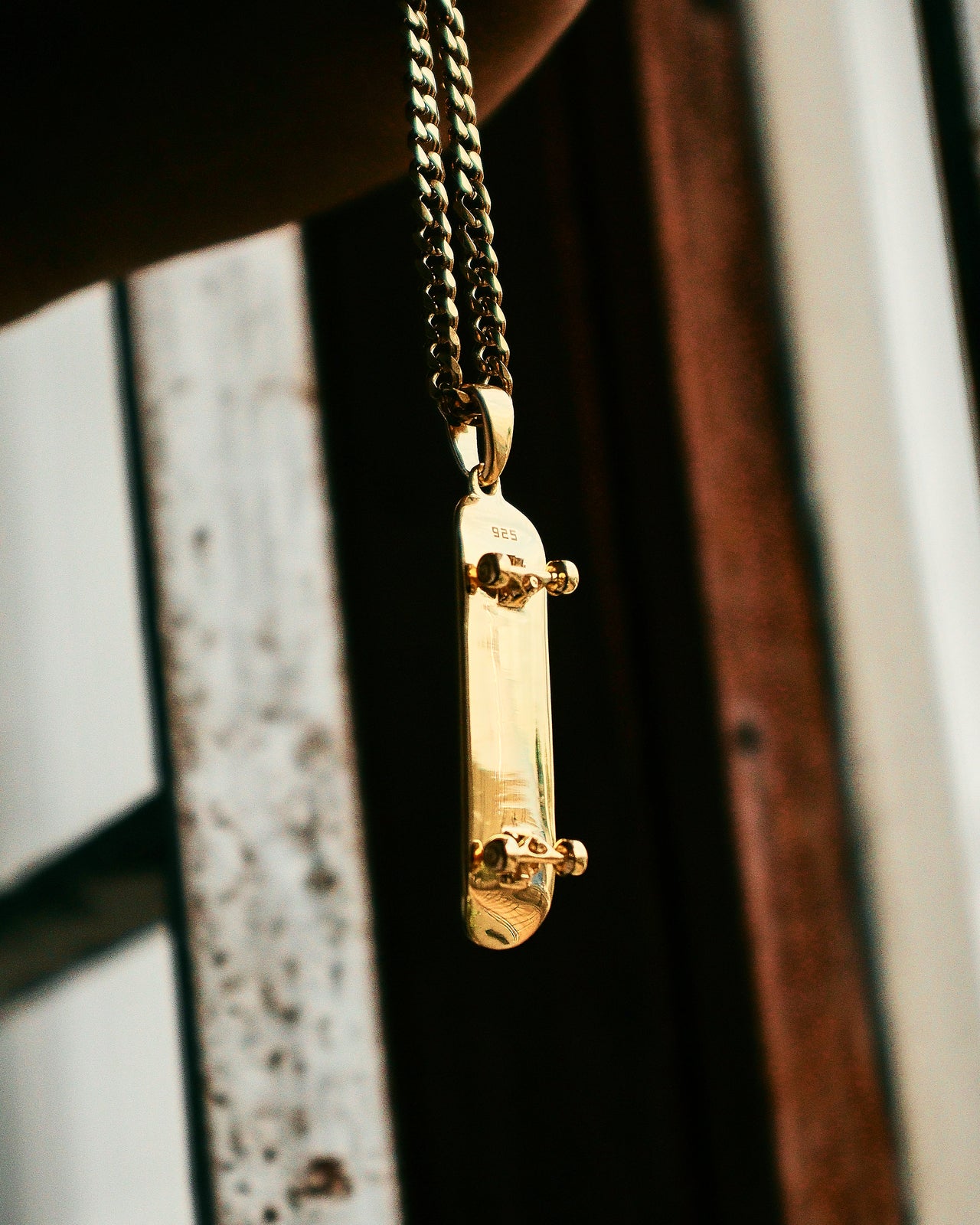 Colgante de patineta (oro)